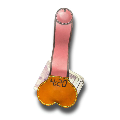 4:20 stoner money clip fully extended, long pink leather strap with magnetic tip above the engraved tan pouch