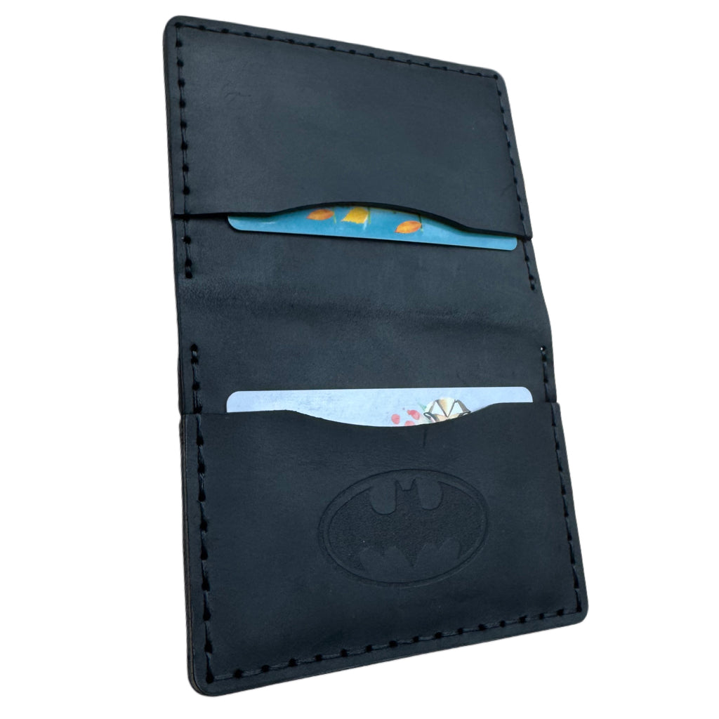 Black leather bat bifold card wallet with two card slots and an embossed bat emblem, hand-stitched edges