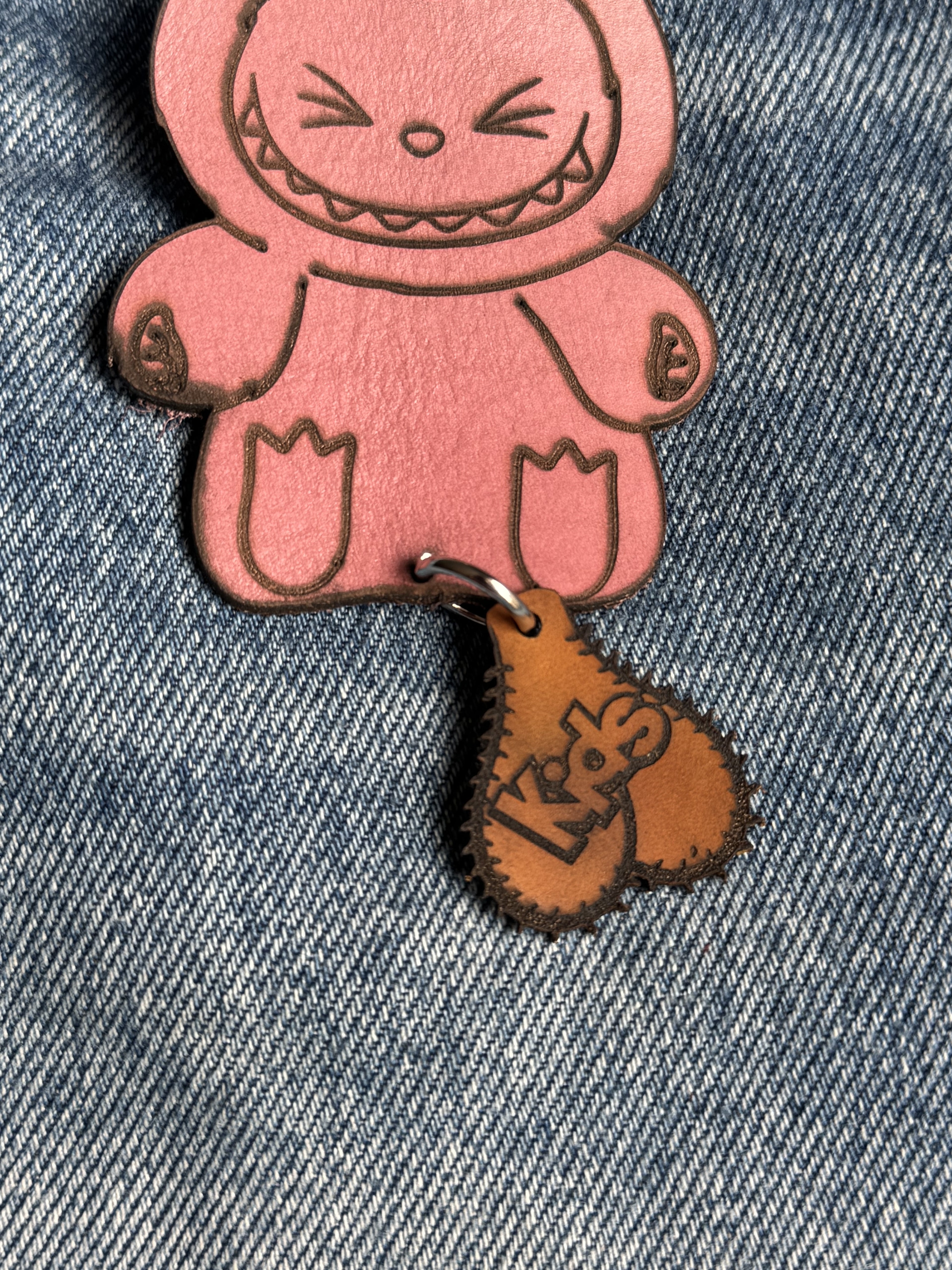 Handcrafted leather character keychain — in-hand view — Lamamarka