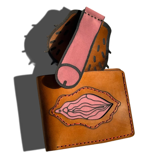 Handcrafted tan leather gift set by Lamamarka featuring a bifold wallet with an intricate, layered anatomical art design in pink and red tones. Accompanied by a uniquely shaped leather carabiner attachment with bold contours. Premium hand-stitched genuine leather with a risqué adult gag gift aesthetic