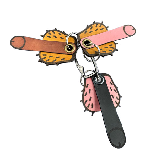 Bold handcrafted leather keychain in pink, brown, and black — Lamamarka