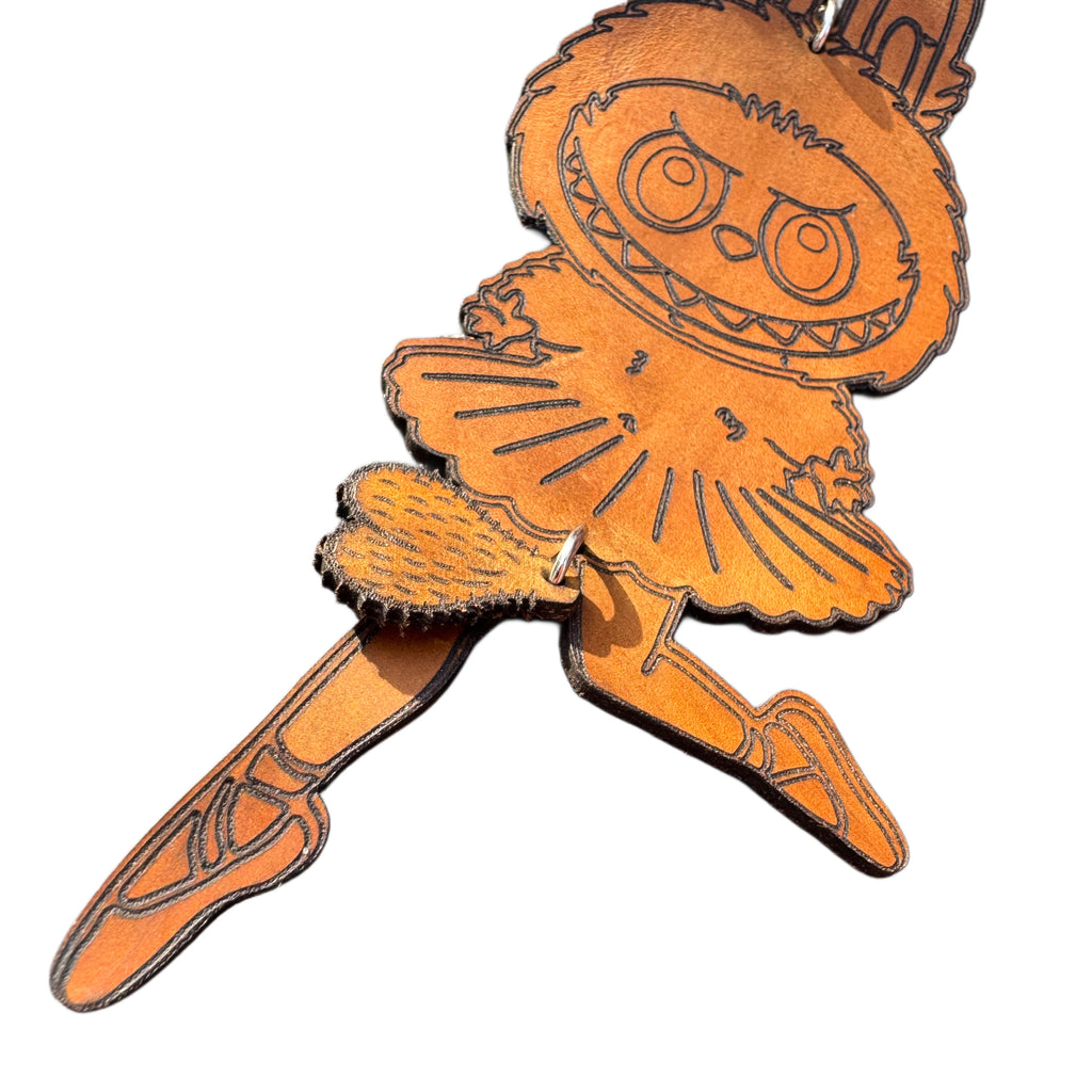 Handcrafted leather character keychain — detail view — Lamamarka
