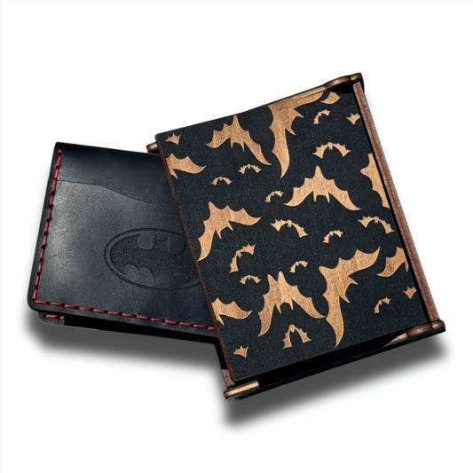 Handmade black leather bat ID wallet with embossed bat emblem beside a wooden gift box with laser-cut bat pattern