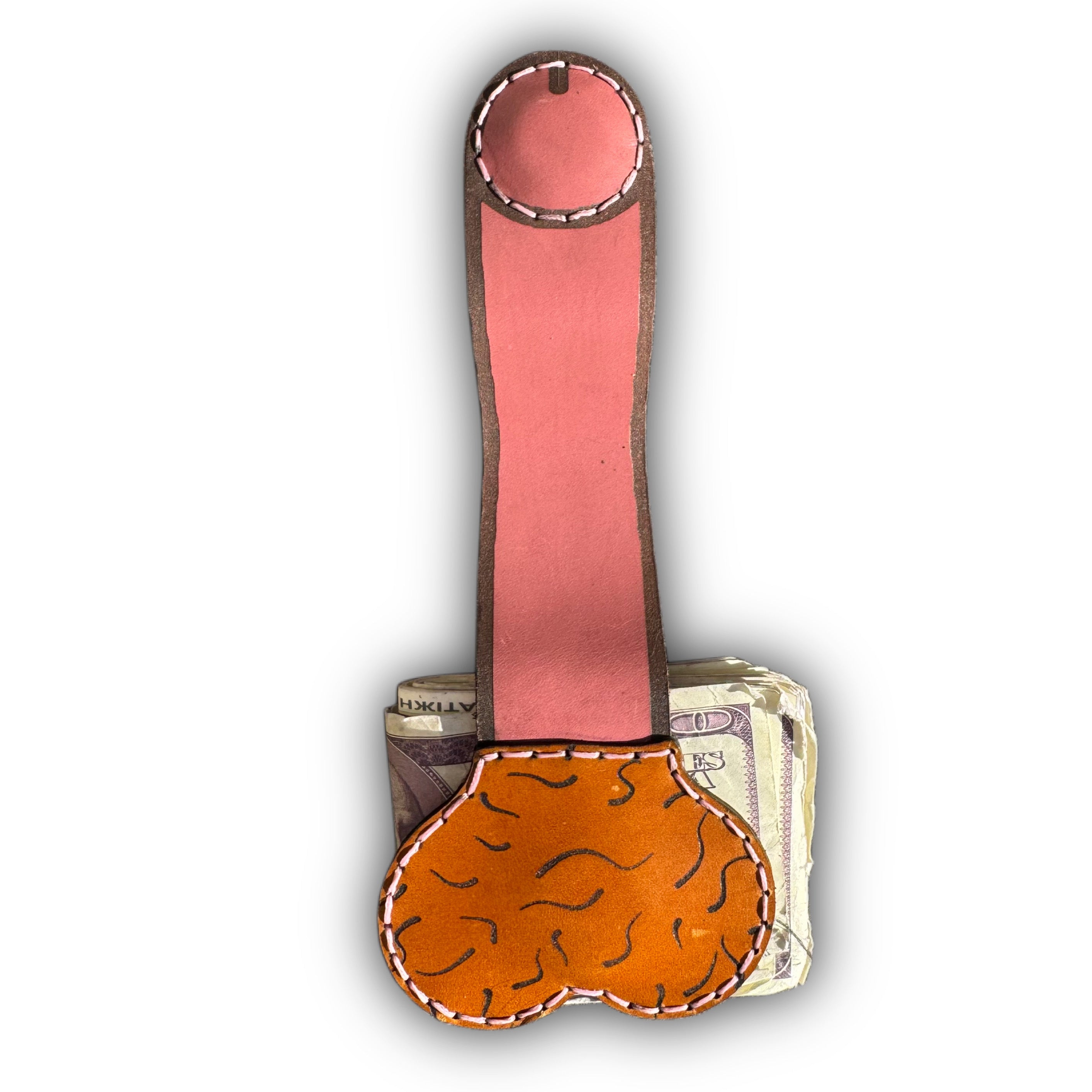Au naturel XL leather money clip fully extended, long pink strap with a round magnetic tip above the tan pouch on folded cash