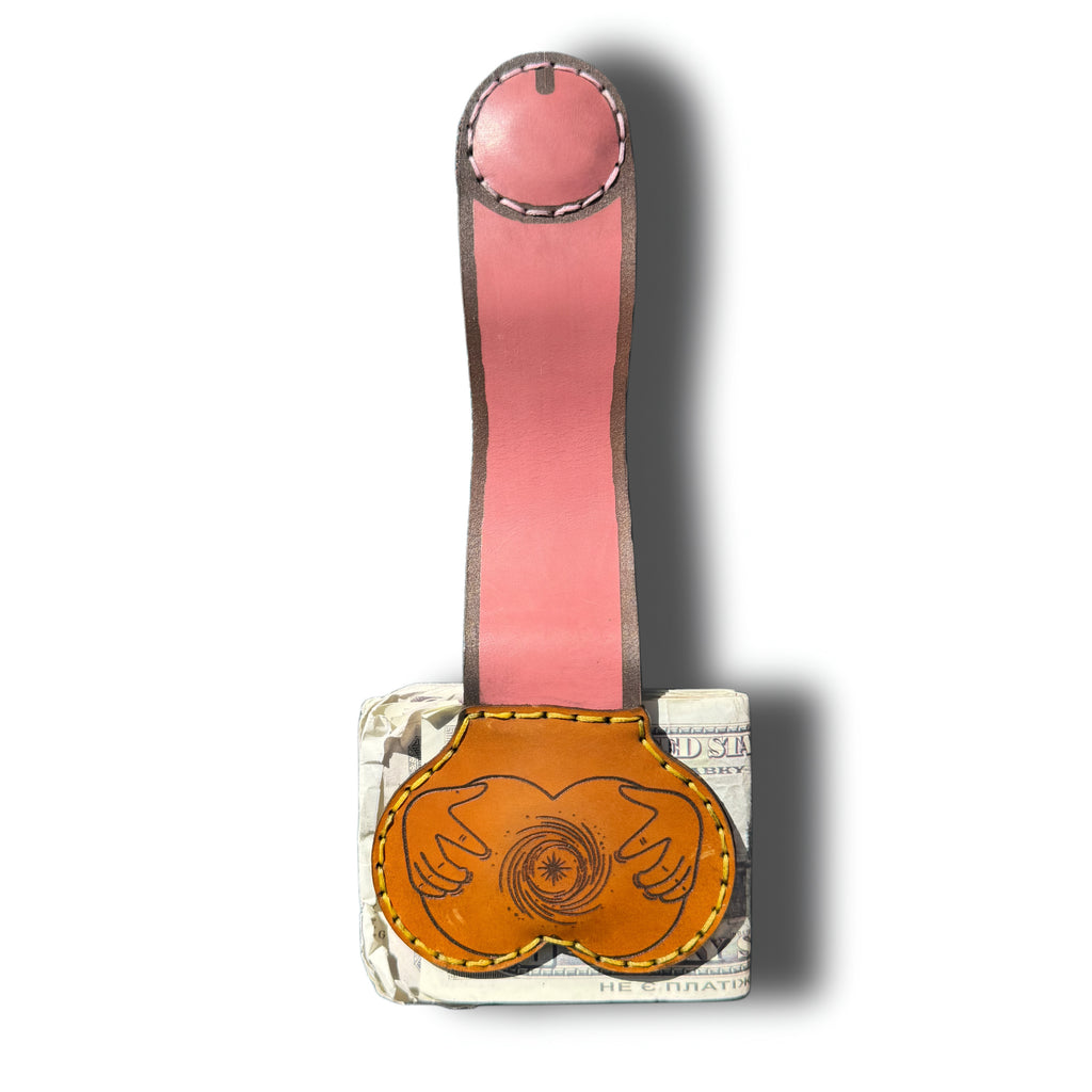 XL booty money clip fully extended, long pink leather strap with magnetic tip above the butt engraved tan pouch