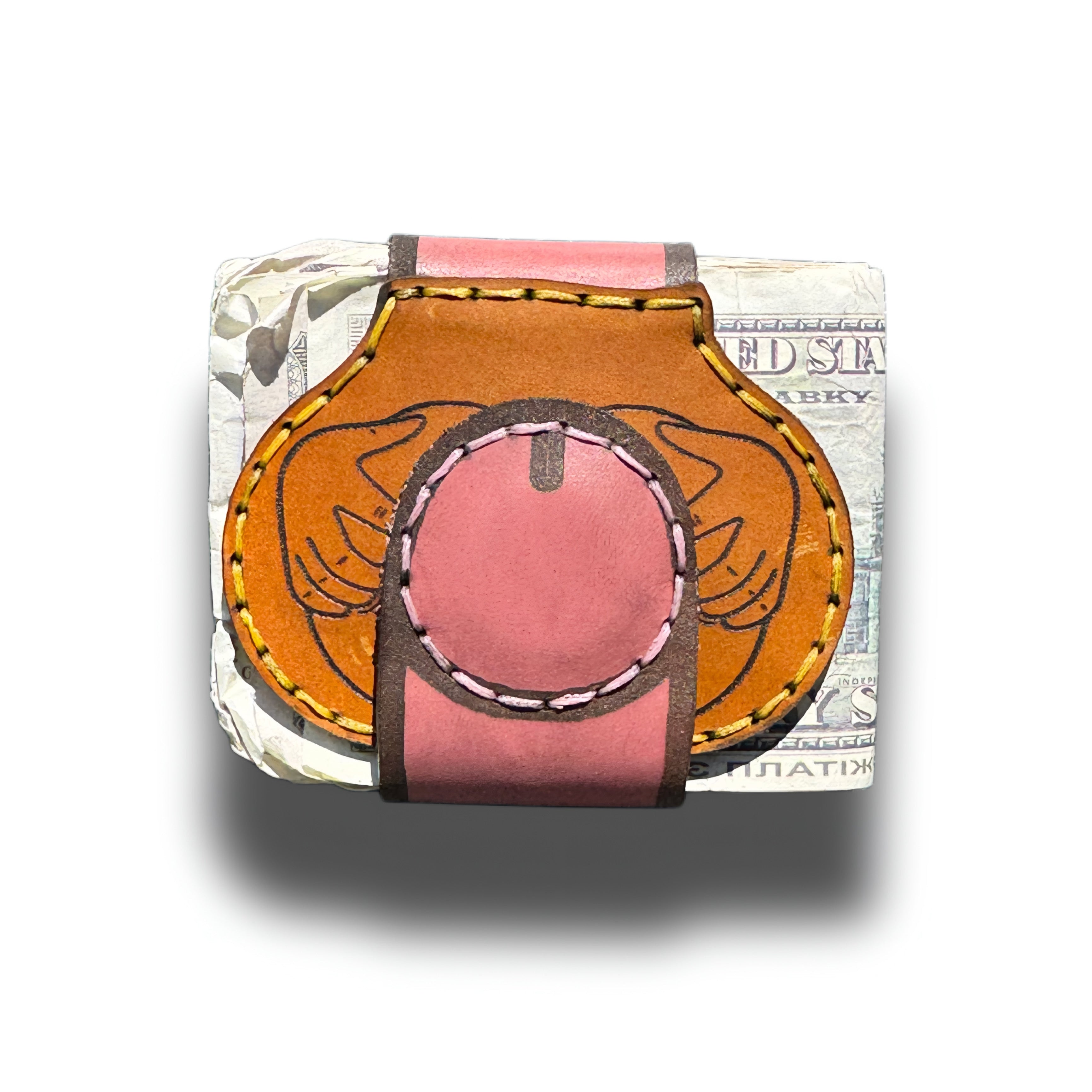 Butt engraved leather money clip closed, pink magnetic strap wrapped over the tan front panel