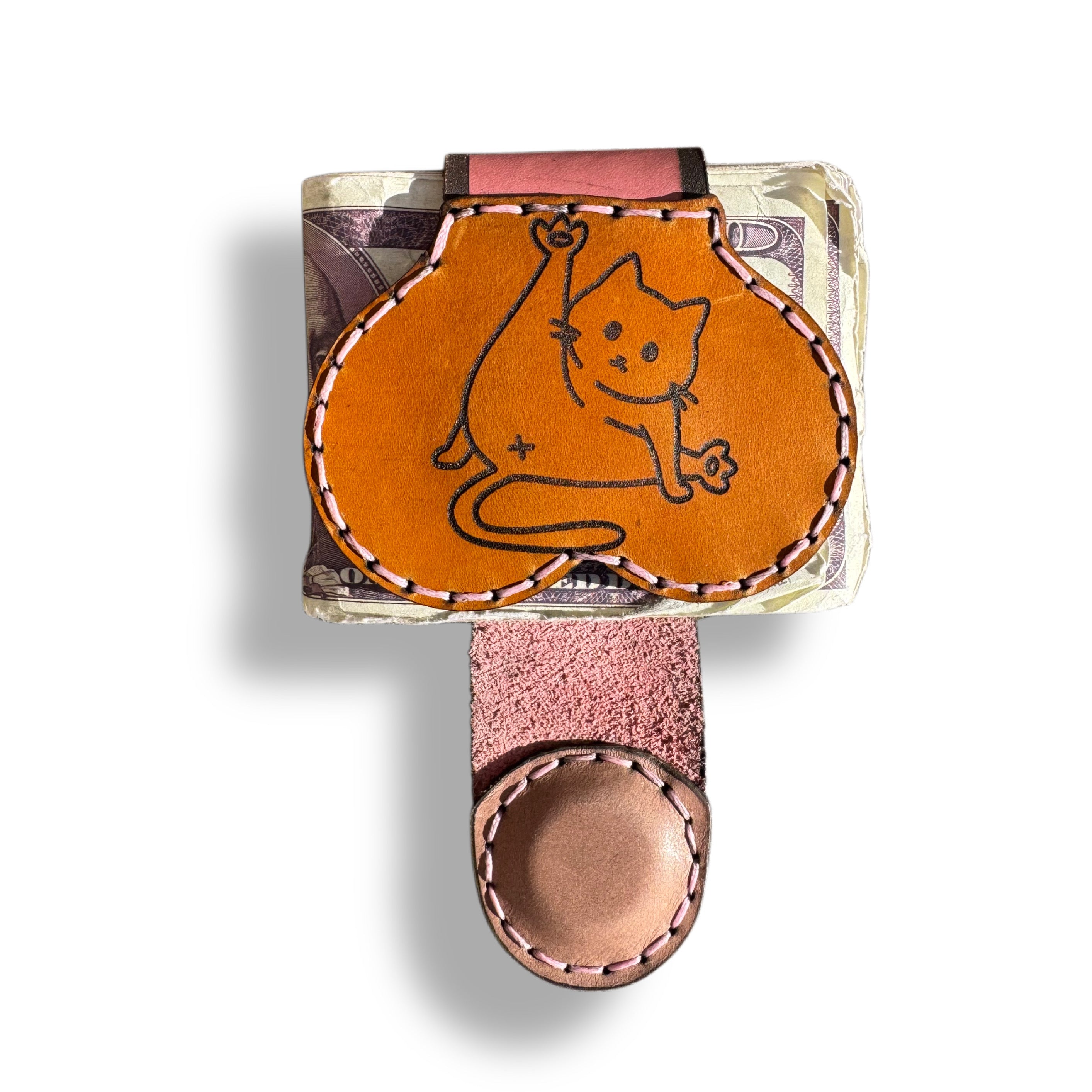 Cat person edition XL leather money clip front, tan panel engraved with a seated cat and a small flower, pink hand stitching around the edge