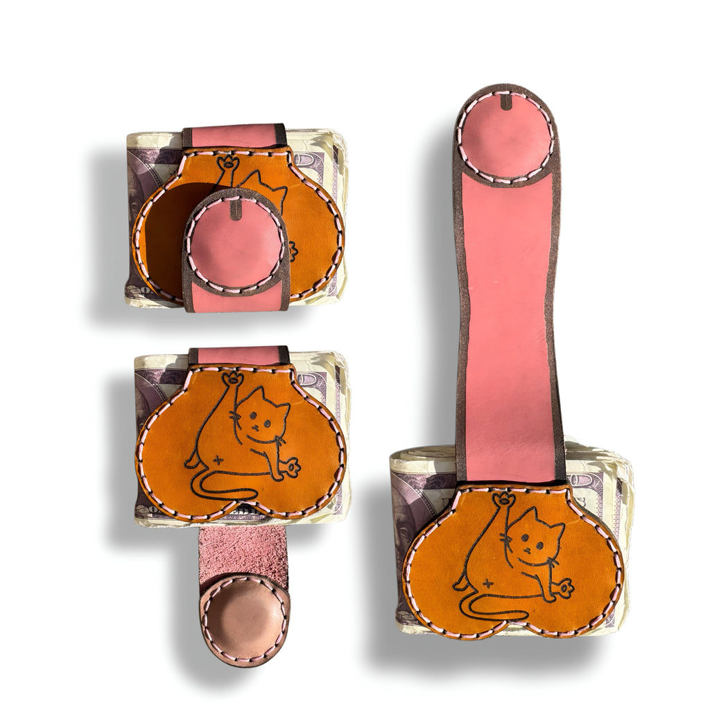 Three views of the cat person edition XL leather money clip, closed, cat engraved front panel, and fully extended pink strap