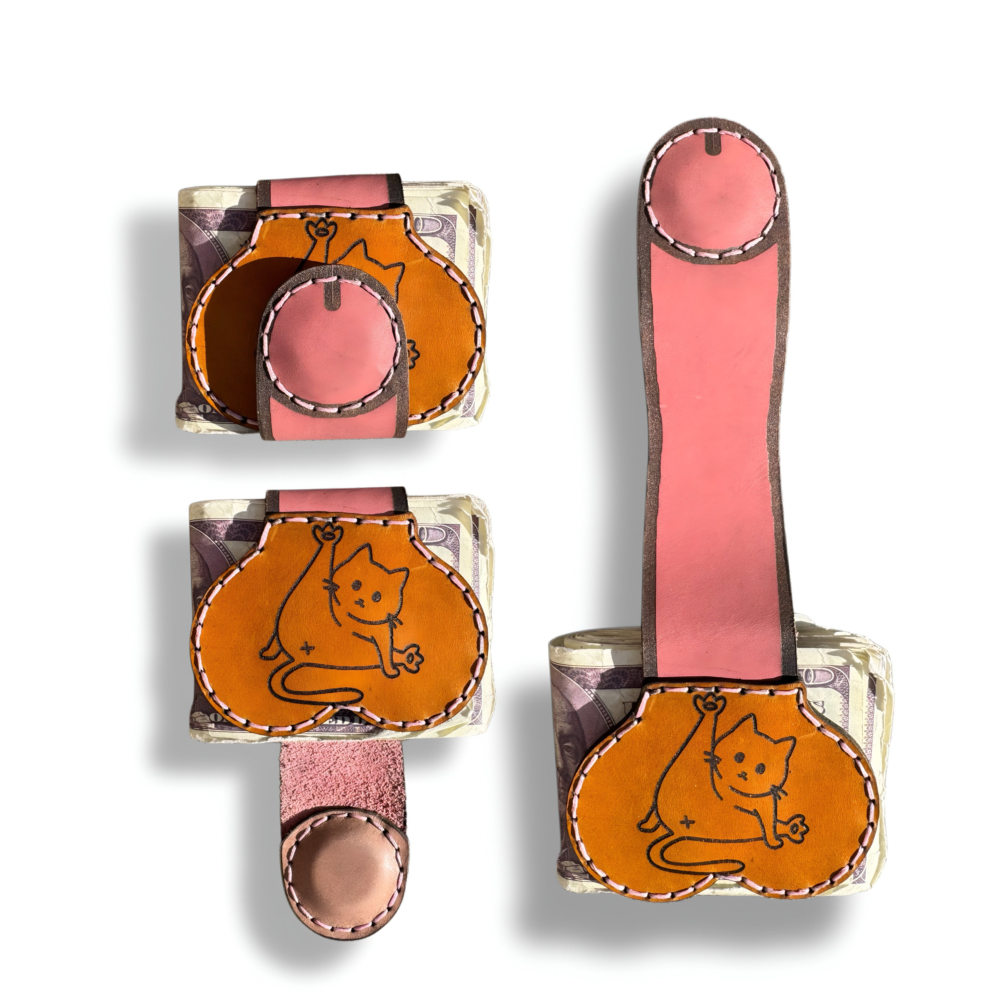 Three views of the cat person edition XL leather money clip, closed, cat engraved front panel, and fully extended pink strap