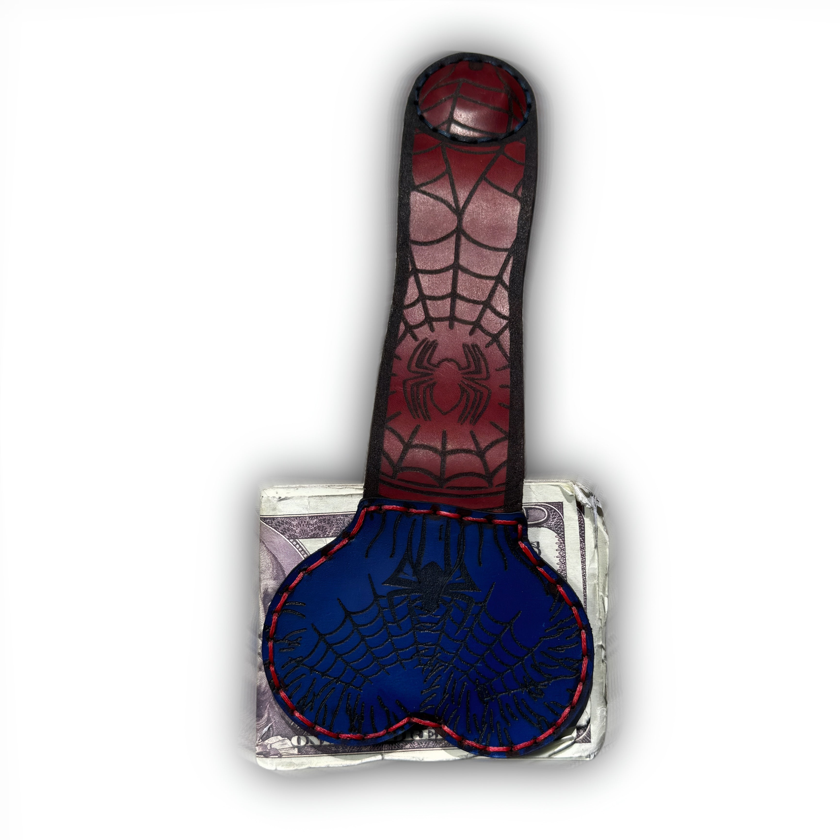 Caught in the web XL leather money clip fully extended, oxblood strap tooled with webs and a spider above the navy pouch