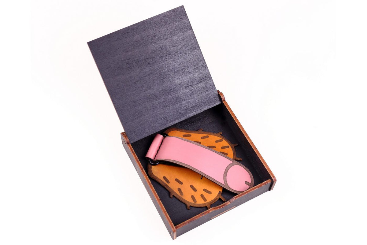 Open Lamamarka wooden gift box with a handmade leather piece inside