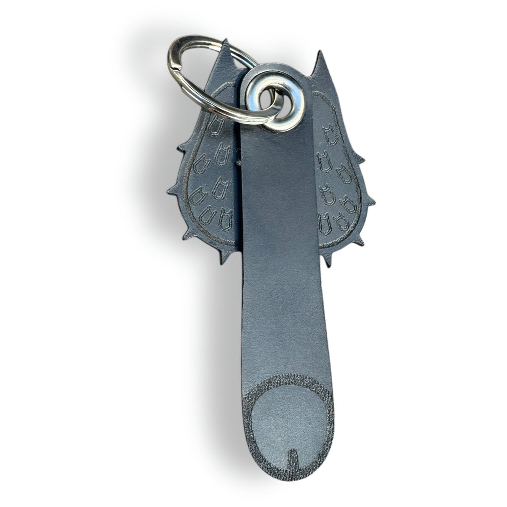 Black leather bat keychain with pointed-ear cowl and engraved bat symbols, front view