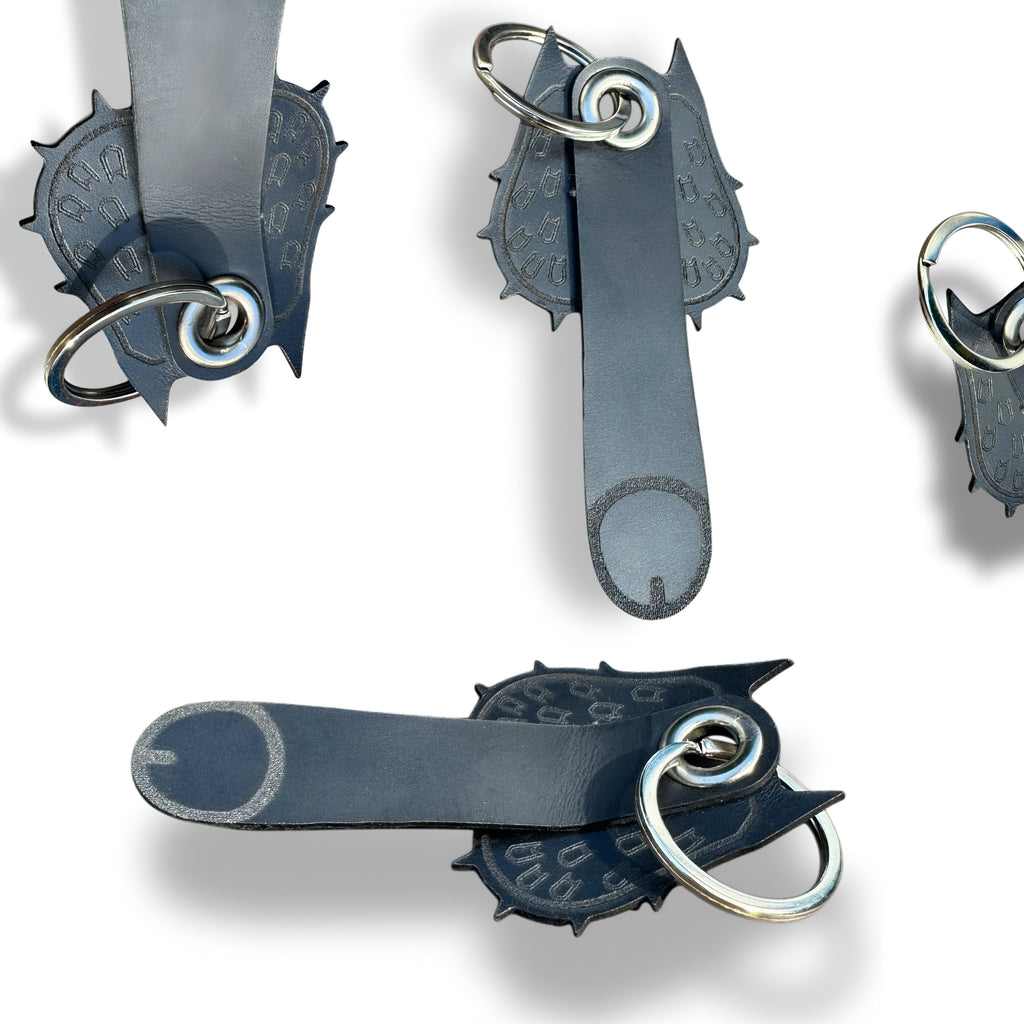 Handmade leather bat keychain shown from four angles with engraved bat symbols and split ring