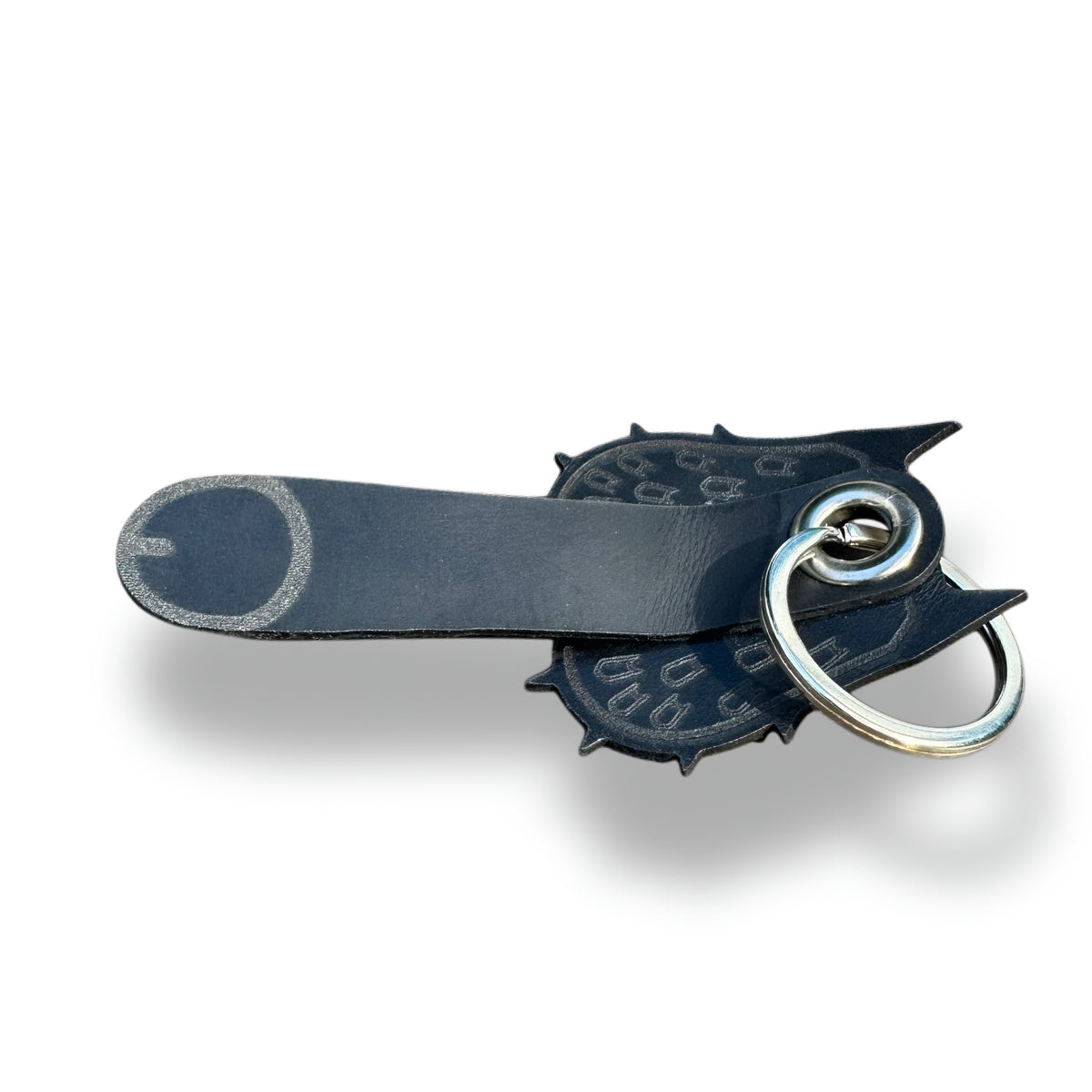 Black leather bat keychain lying flat, full length with steel split ring and engraved tip