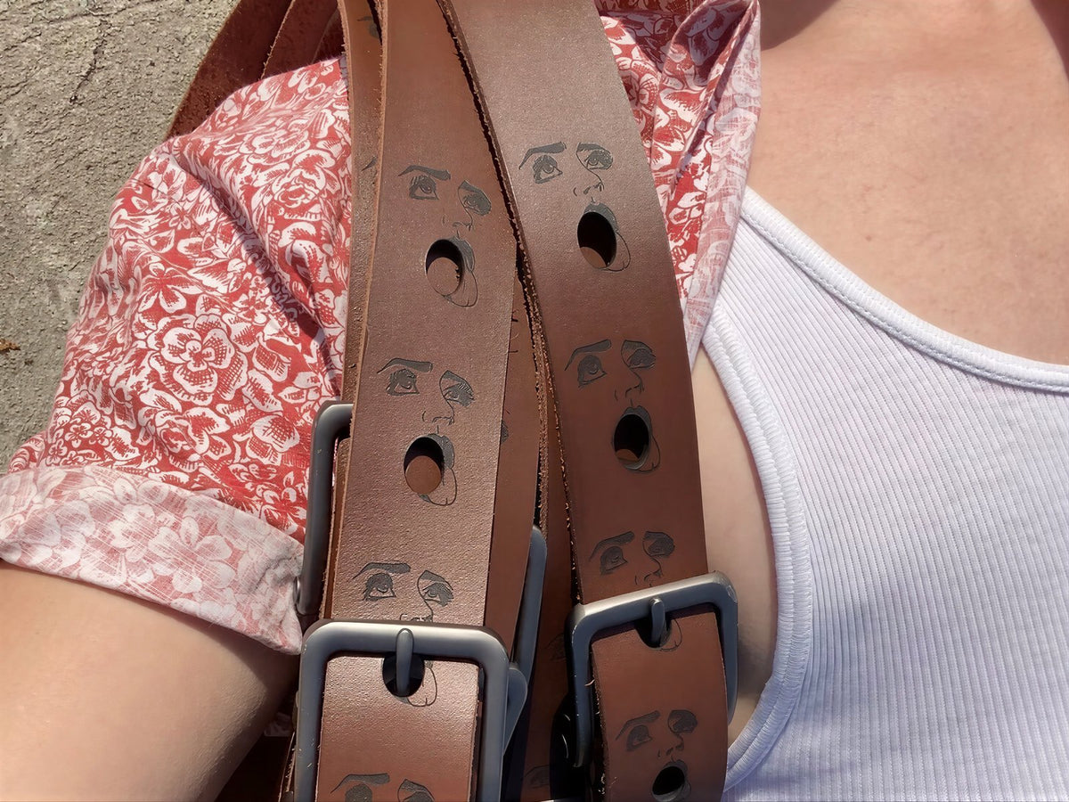 Brown full-grain leather belts engraved with expressive faces, Lamamarka