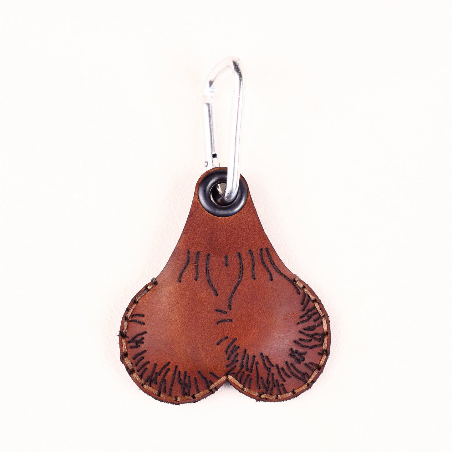 Hand-stitched leather AirTag pouch with steel carabiner, novelty AirTag keychain by Lamamarka