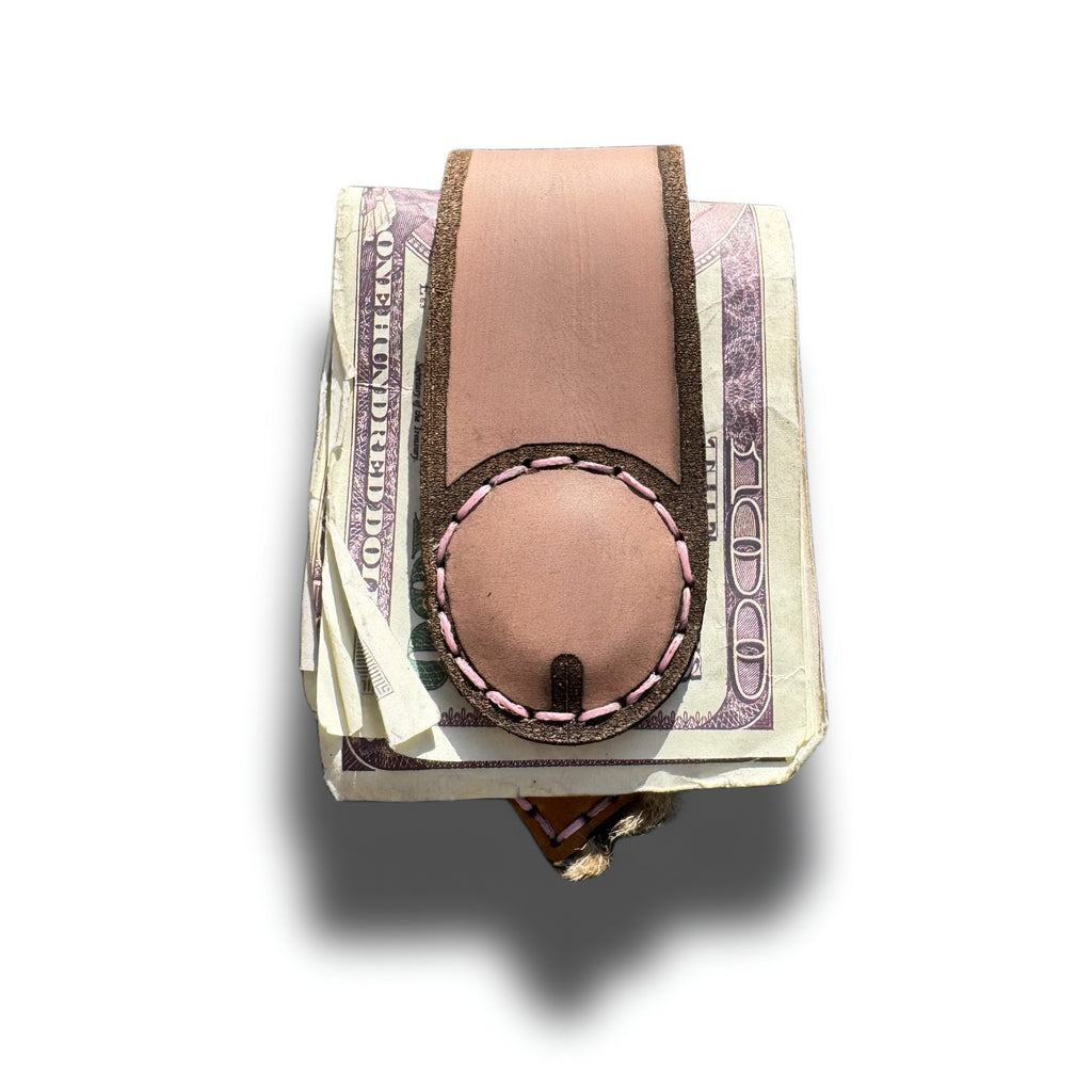 Hand-engraved leather money clip for her holding a fold of cash, Lamamarka