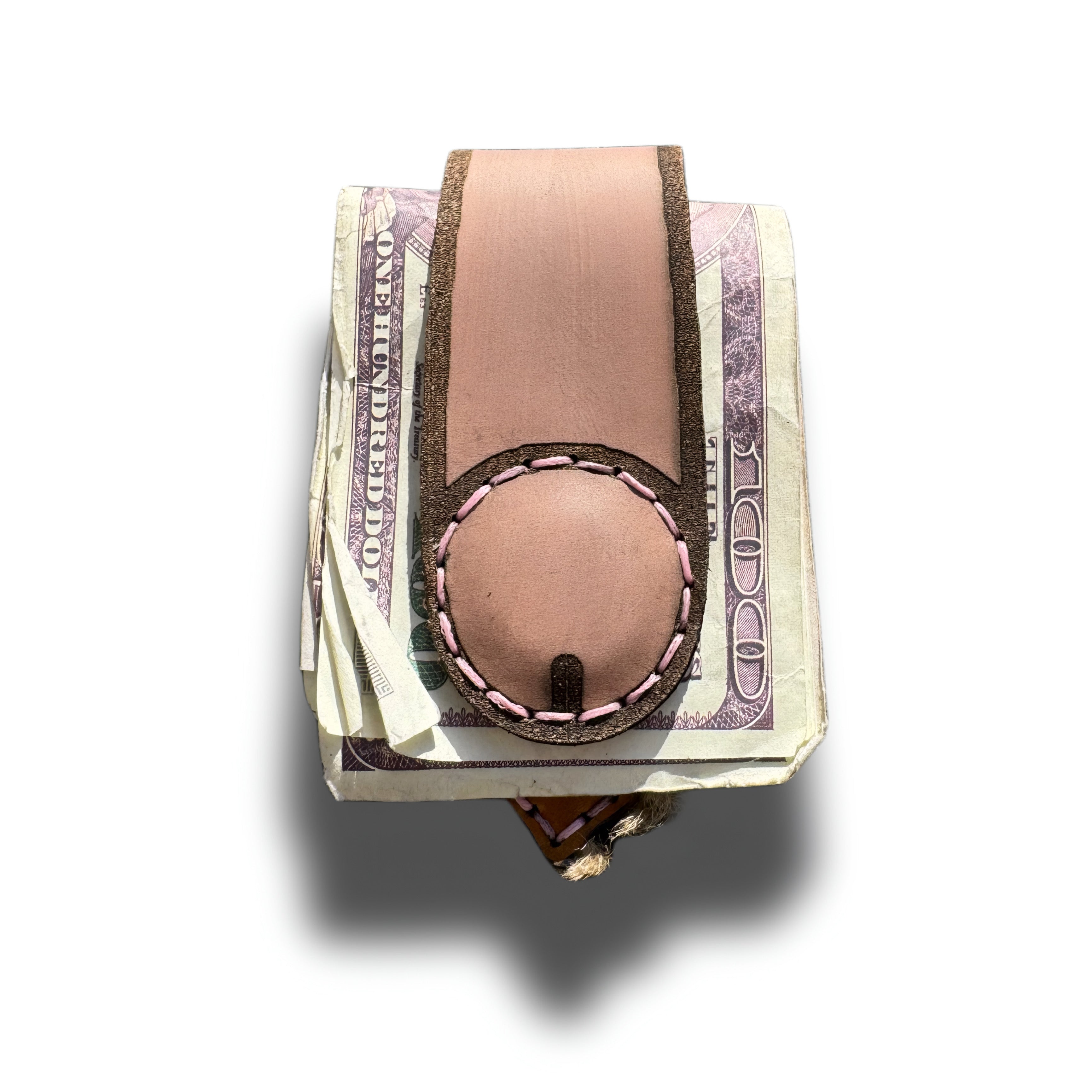 Hand-engraved leather money clip for her holding a fold of cash, Lamamarka