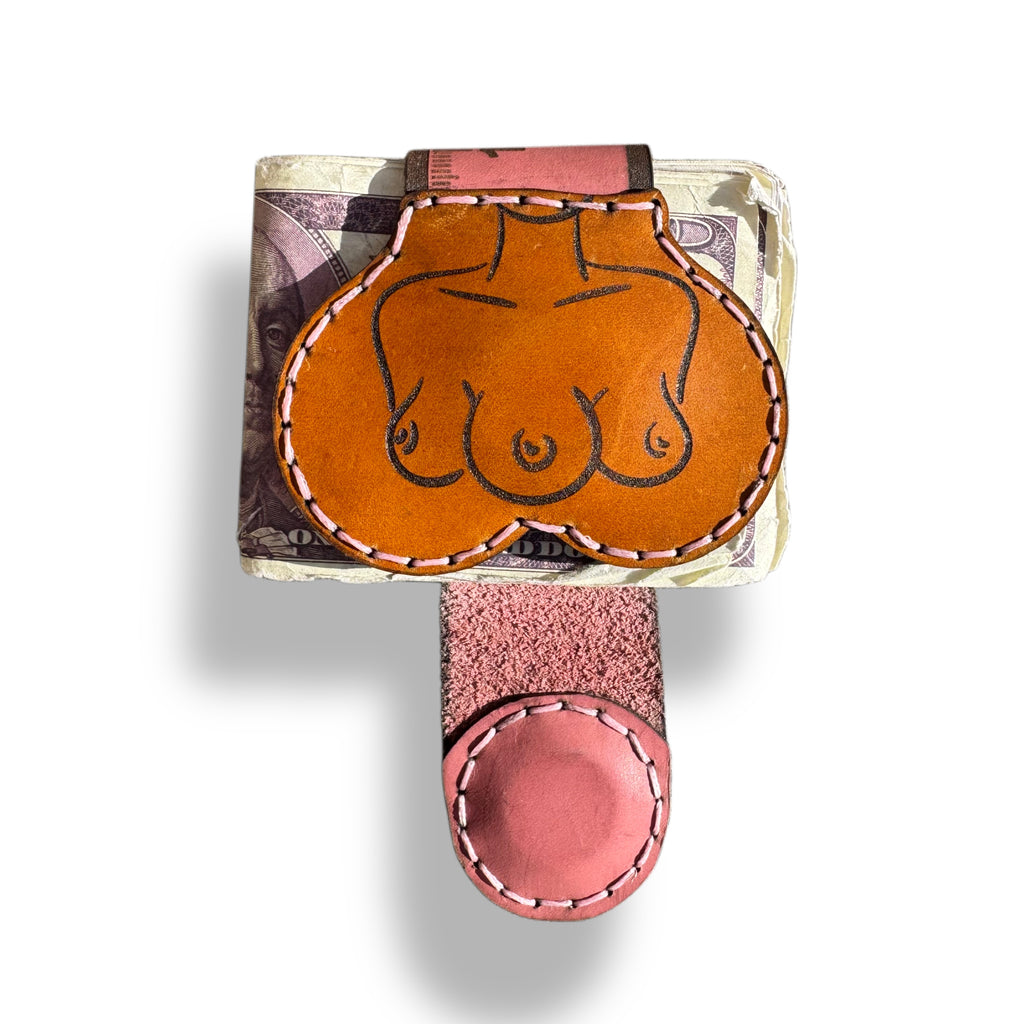 Ruler edition XL leather money clip front, tan panel hand-engraved with a torso outline, pink strap folded over a stack of bills