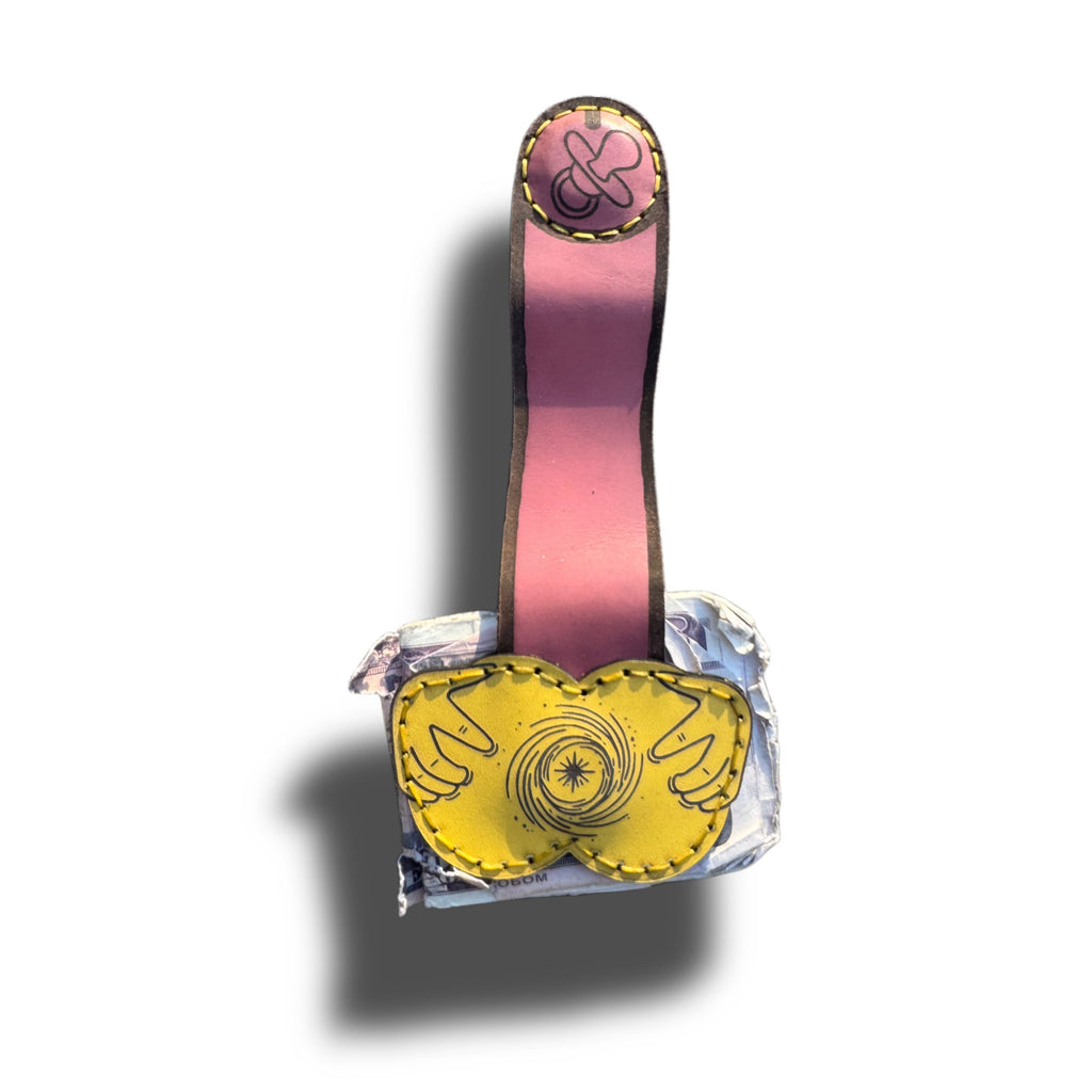 XL money clip extended, long pink strap with engraved tip over yellow leather base