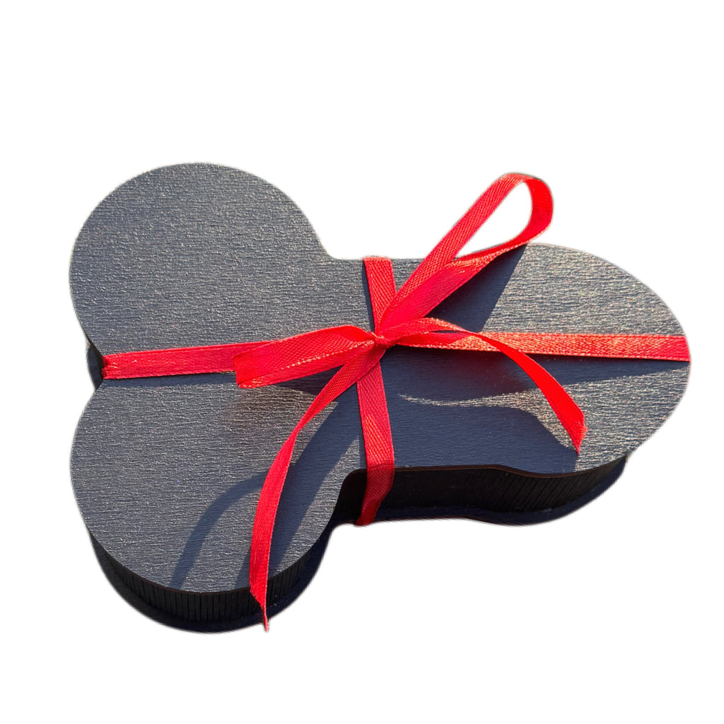 The Package black wooden gift box tied with a red satin ribbon bow