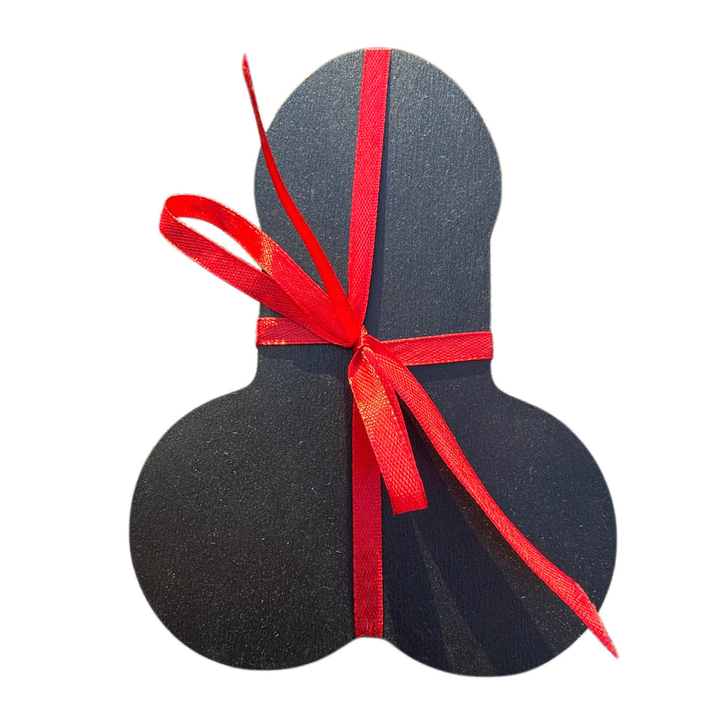 Top view of The Package shaped wooden gift box wrapped in red ribbon