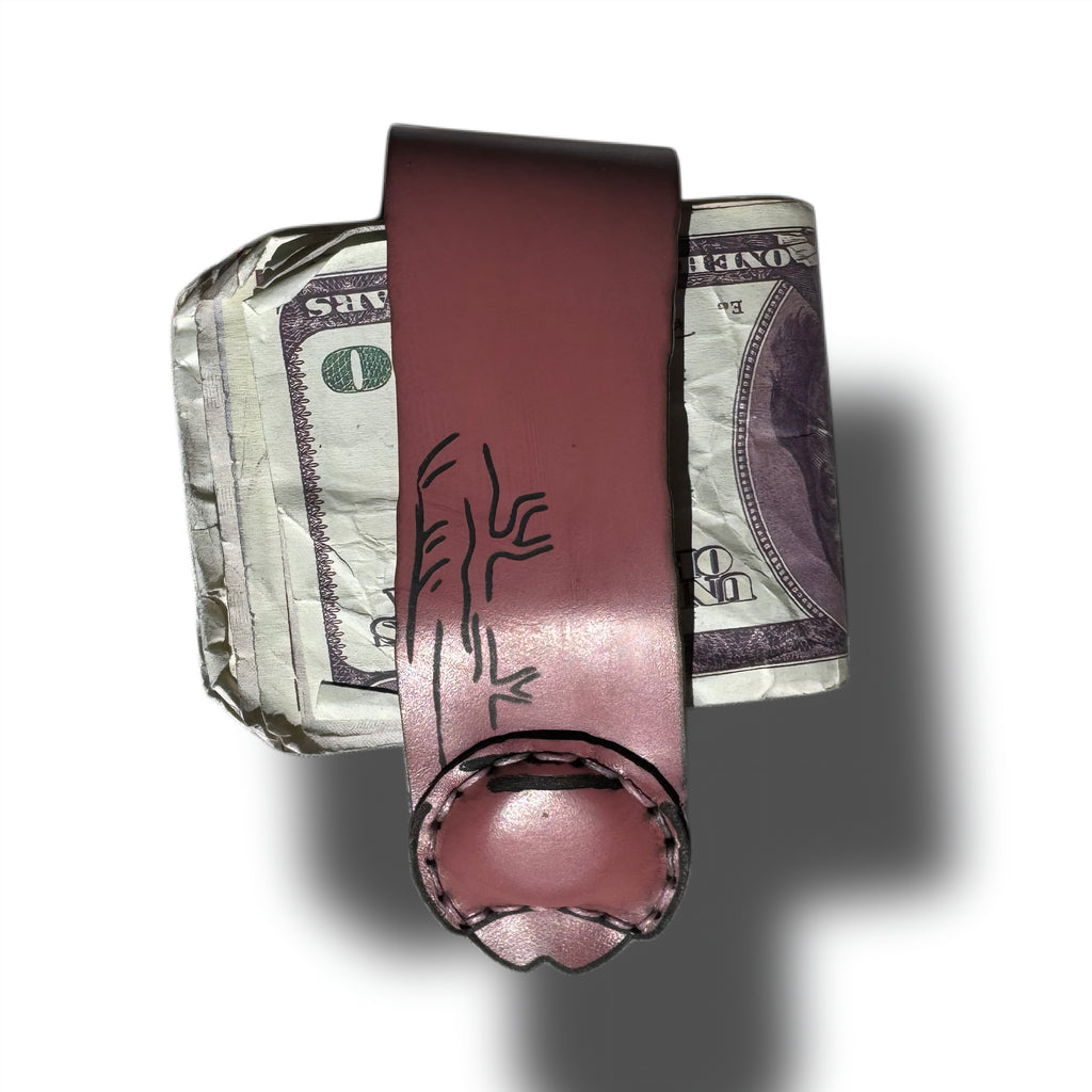 Reverse side of the uncut edition XL leather money clip wrapped around a fold of bills